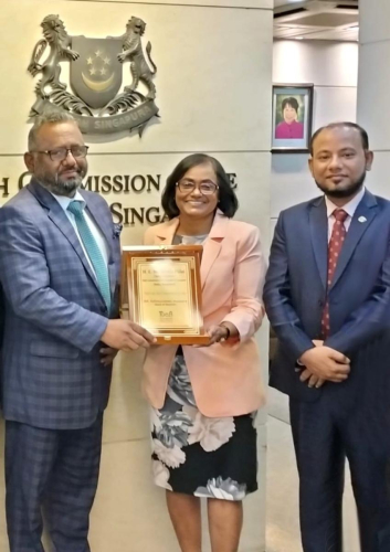 Crest Handover to Her Excellency High Commissioner of Singapore in Middle and President of Toab in left.